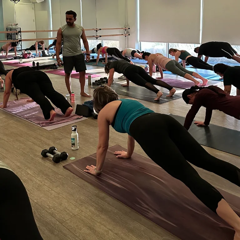 Instructor leading a group fitness class at Ora